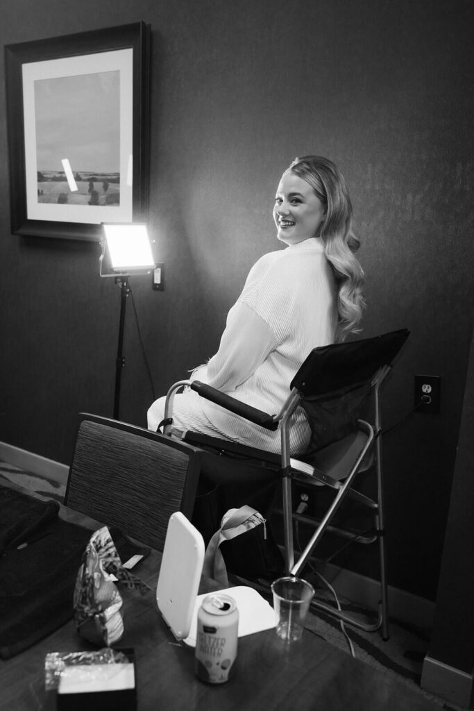 Bride and her bridesmaids getting ready in an AirBnB for a wedding at the New York Botanical Gardens. Photo by OkCrowe Photography.