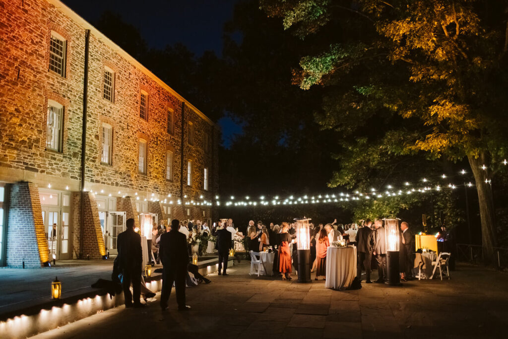 Dance floor of a wedding reception at the Stone Mill in the New York Botanical Gardens. Photo by OkCrowe Photography.