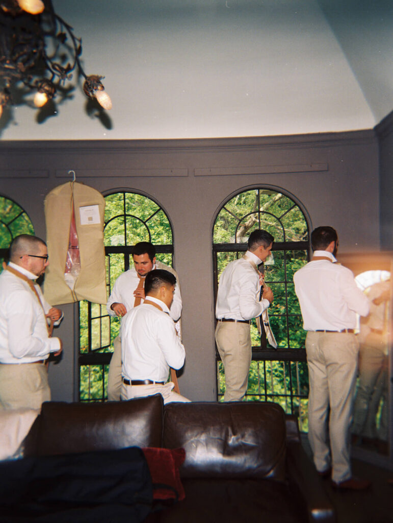 Groom and groomsmen getting ready at Arrow Park. Photo by OkCrowe Photography.