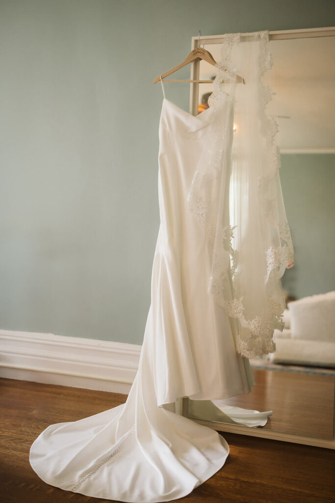 Wedding dress hanging in the bridal suite of Arrow Park. Photo by OkCrowe Photography.