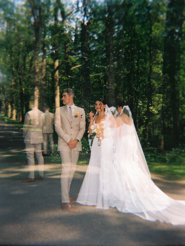 Bride and groom first look along a tree-lined road at Arrow Park. Photo by OkCrowe Photography.  