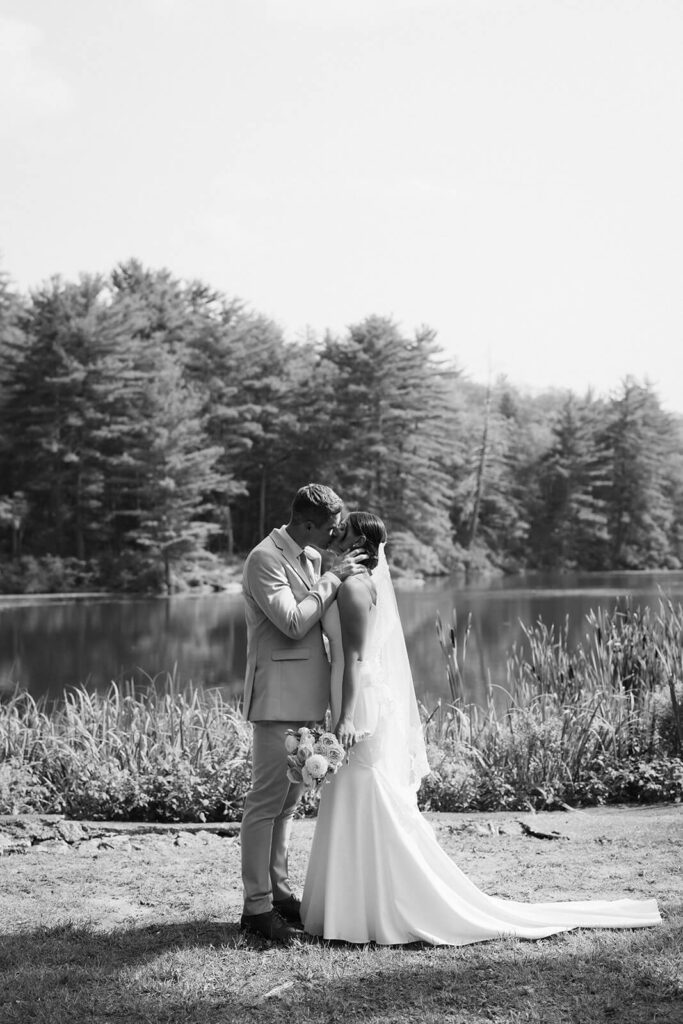 Bride and groom portraits by the lake at Arrow Park. Photo by OkCrowe Photography.  