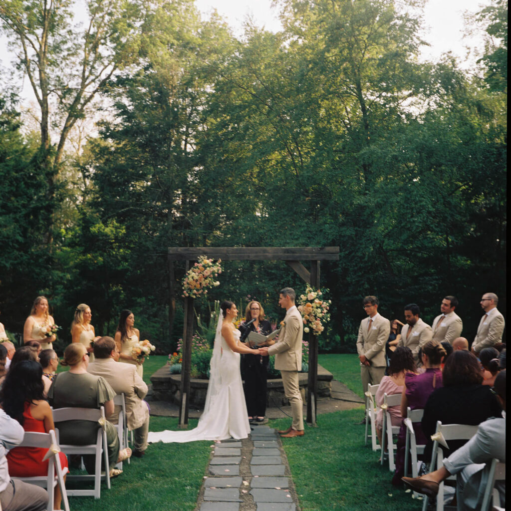 Wedding ceremony in Arrow Park's European-style garden. Photo by OkCrowe Photography.  