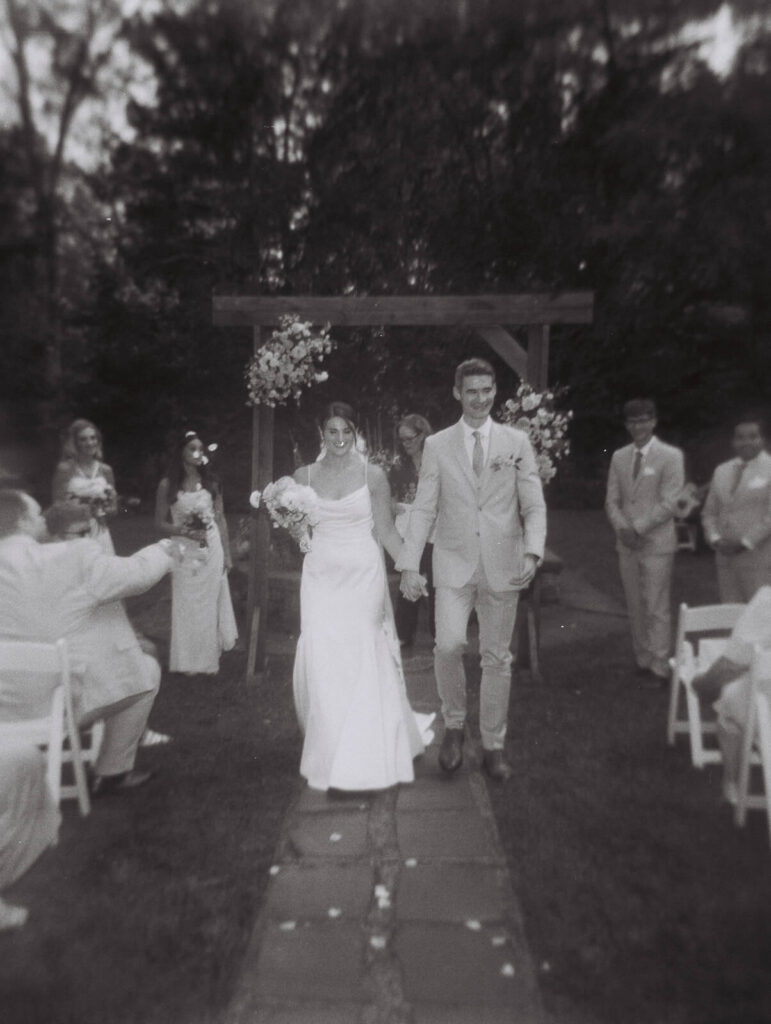 Wedding ceremony in Arrow Park's European-style garden. Photo by OkCrowe Photography.  