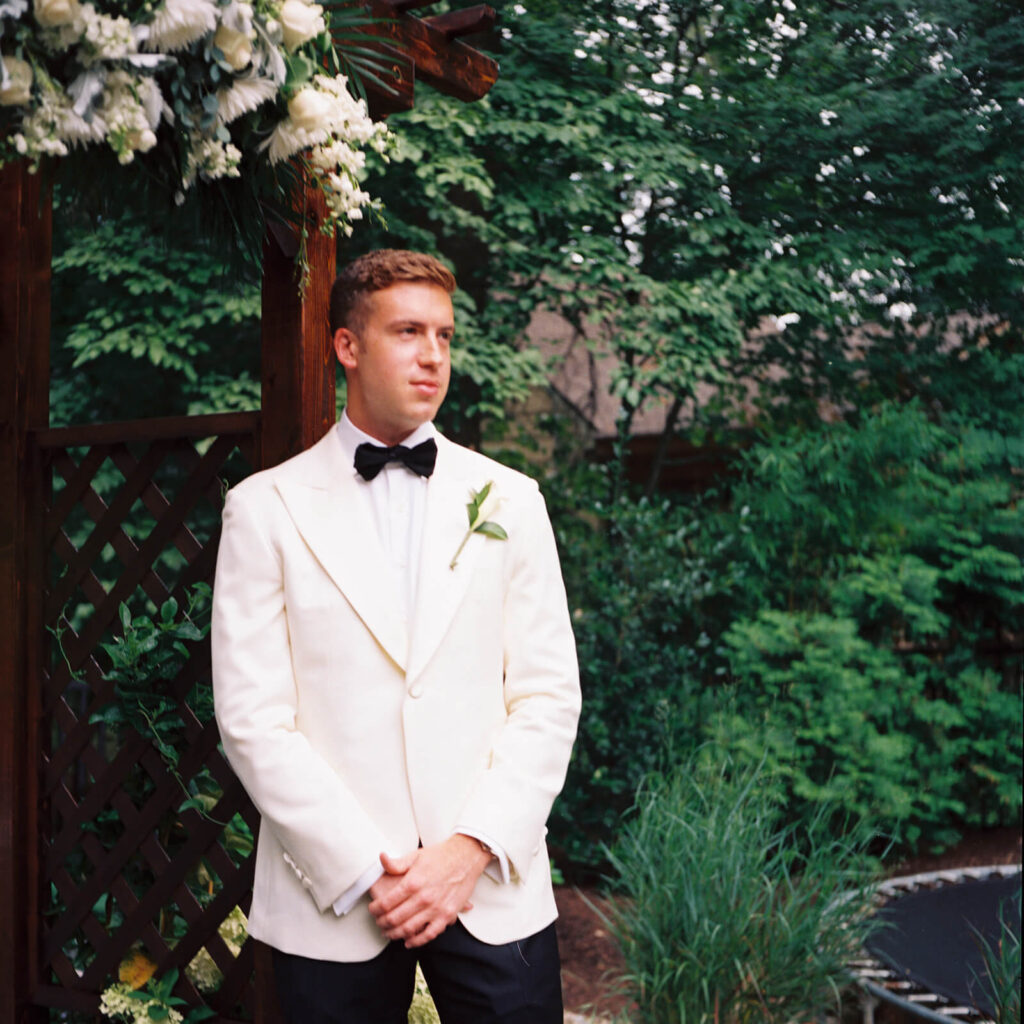Wedding ceremony in bride's childhood home in Mahwah, NJ. Photo by OkCrowe Photography. 