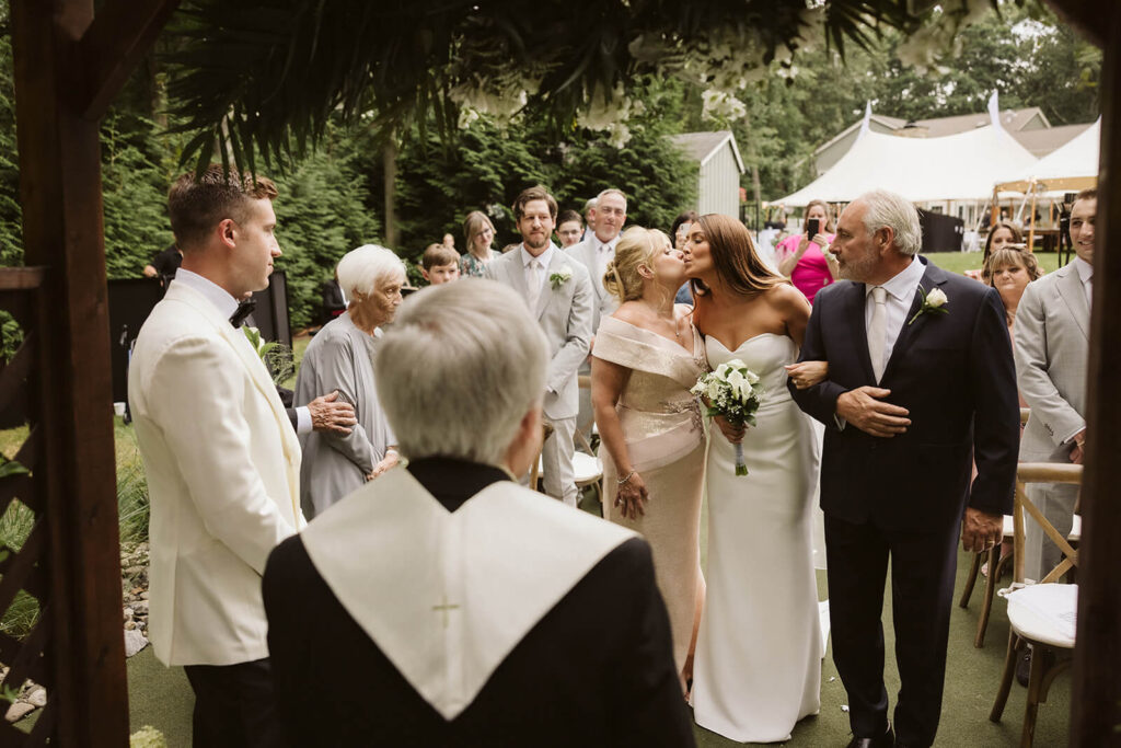 Wedding ceremony in bride's childhood home in Mahwah, NJ. Photo by OkCrowe Photography. 