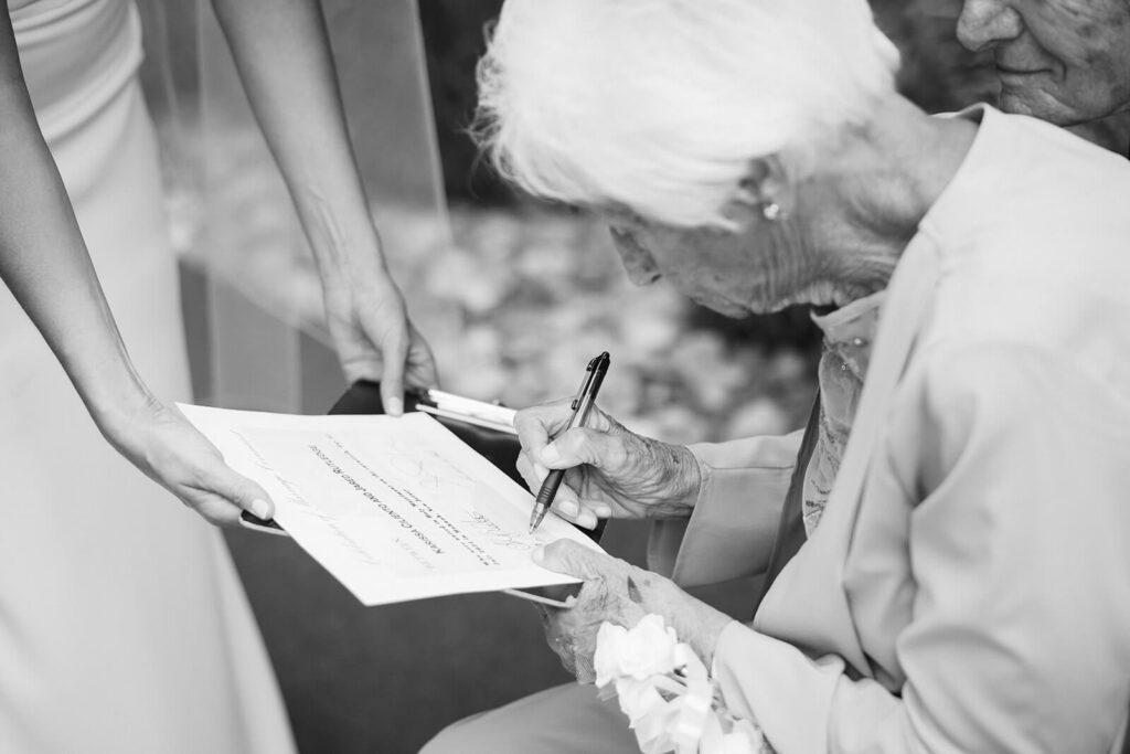 Wedding ceremony in bride's childhood home in Mahwah, NJ. Photo by OkCrowe Photography. 