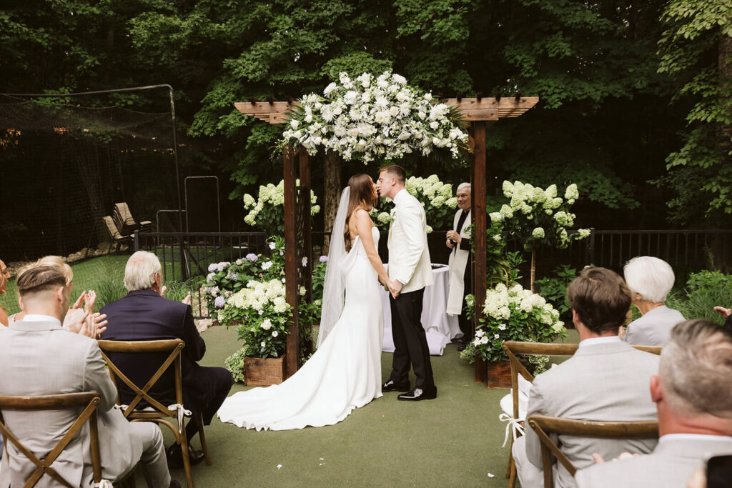 Wedding ceremony in bride's childhood home in Mahwah, NJ. Photo by OkCrowe Photography. 