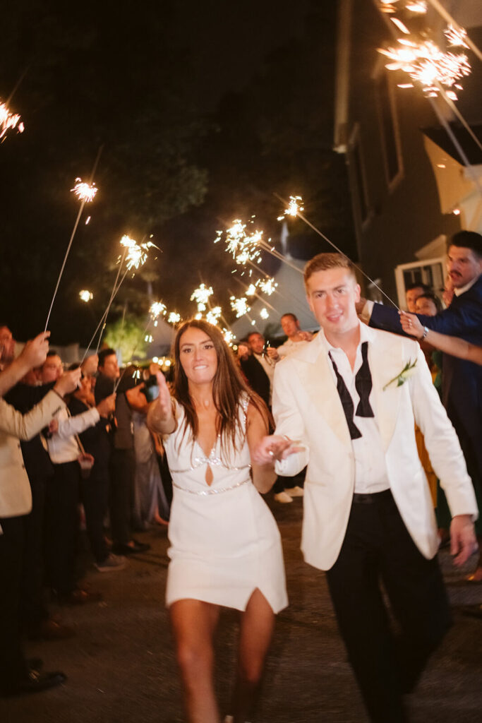 Sparkler send off after a wedding in the bride's parents' backyard in Mahwah, NJ. Photo by OkCrowe Photography. 