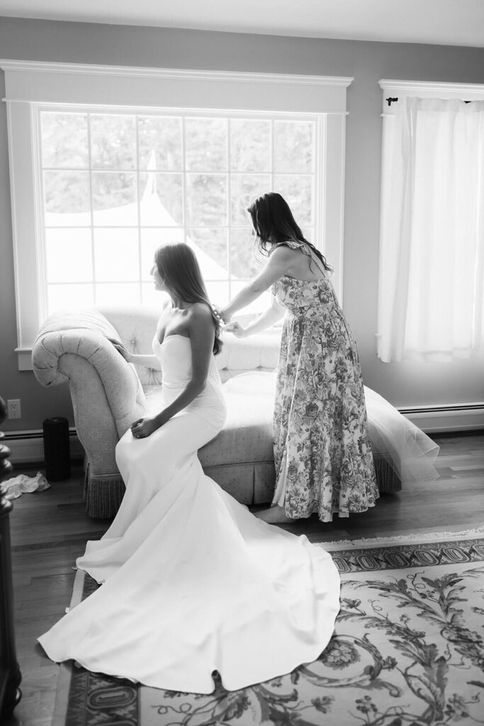 Bride and bridesmaids getting ready for her wedding in her parents' home. Photo by OkCrowe Photography. 