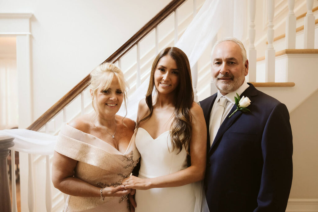 Father-daughter first look in the bride's childhood home. Photo by OkCrowe Photography. 