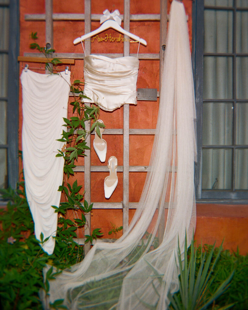 Bride's wedding dress hanging at the Grounds for Sculpture. Photo by OkCrowe Photography. 