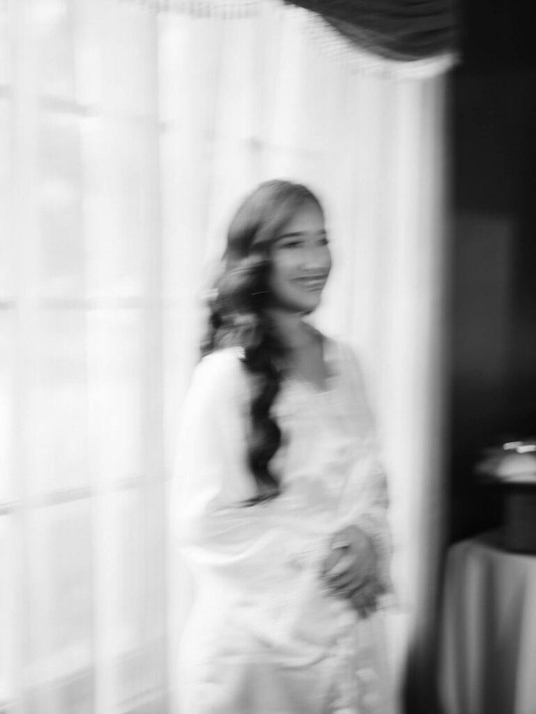 Bride getting ready in a suite at the Grounds for Sculpture. Photo by OkCrowe Photography. 