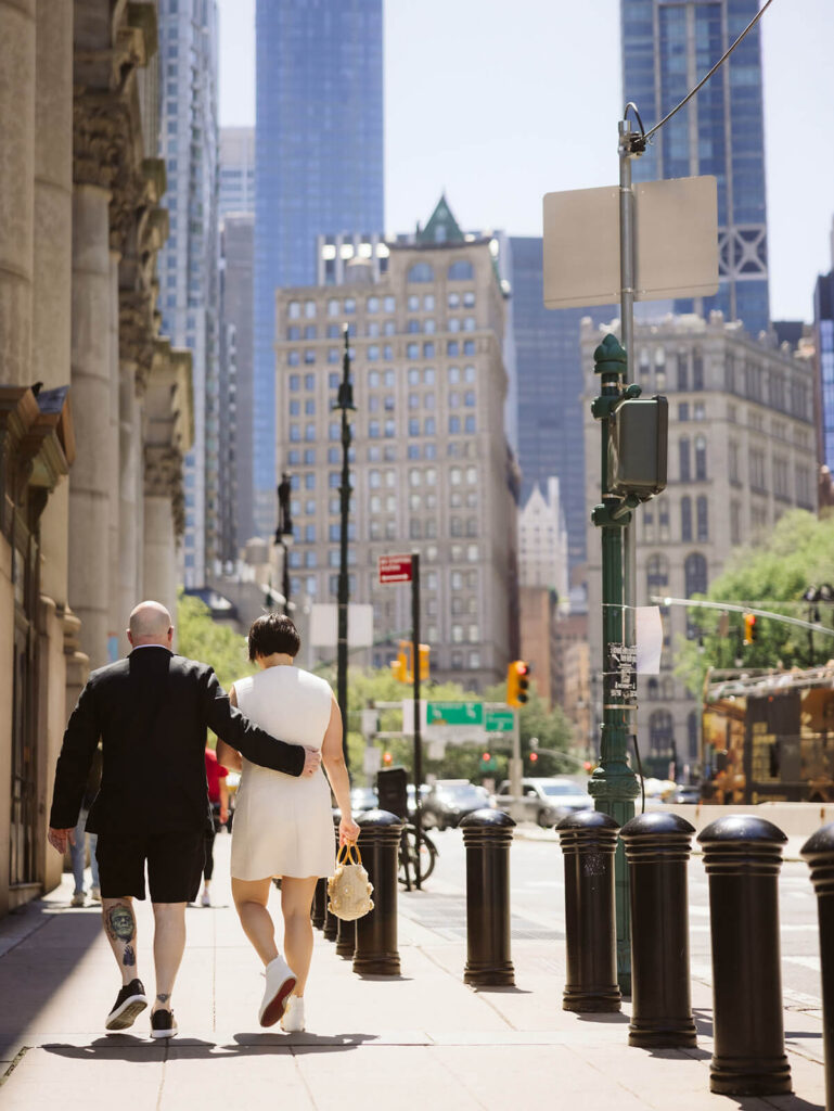 Newlyweds portraits after their courthouse ceremony leaving the NYC Courthouse. Photo by OkCrowe Photography.