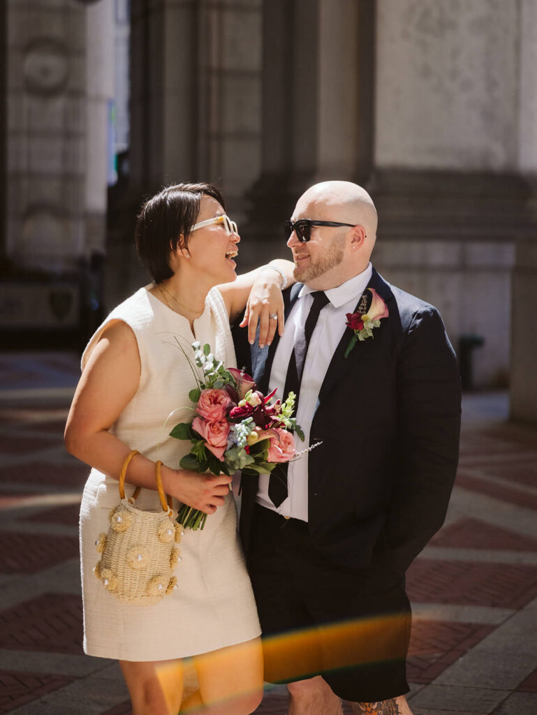 Newlyweds portraits after their courthouse ceremony leaving the NYC Courthouse. Photo by OkCrowe Photography.