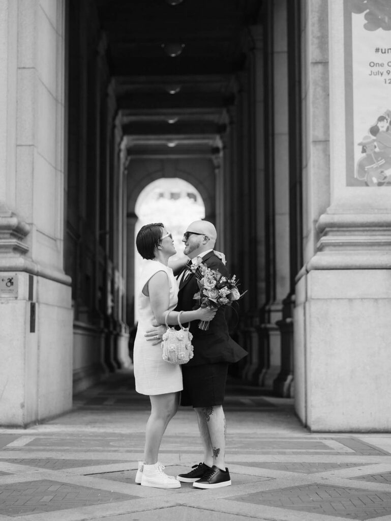 Newlyweds portraits after their courthouse ceremony leaving the NYC Courthouse. Photo by OkCrowe Photography.