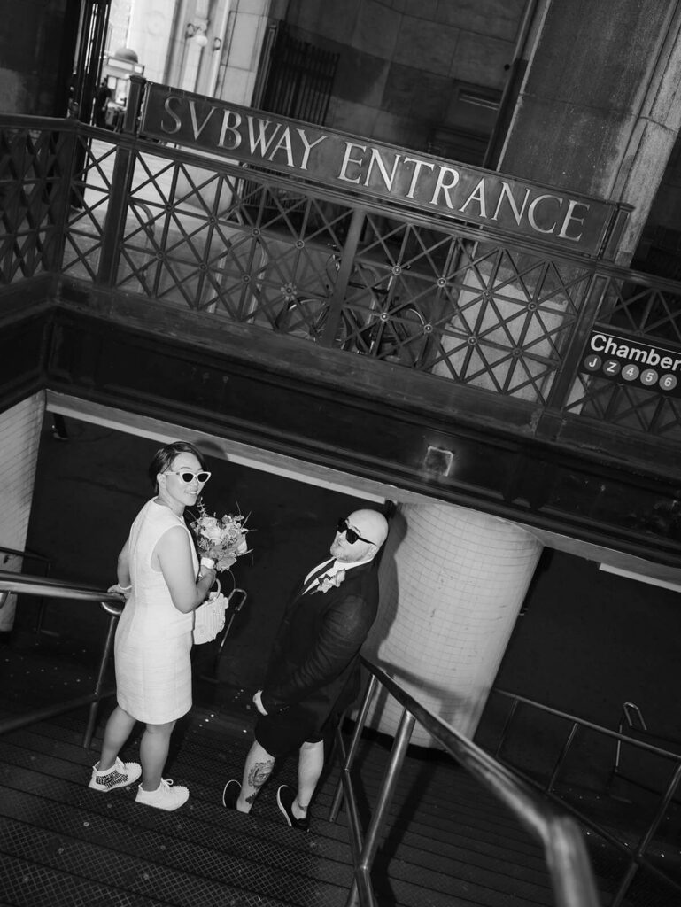 Newlyweds portraits after their courthouse ceremony at the NYC Courthouse subway station. Photo by OkCrowe Photography.