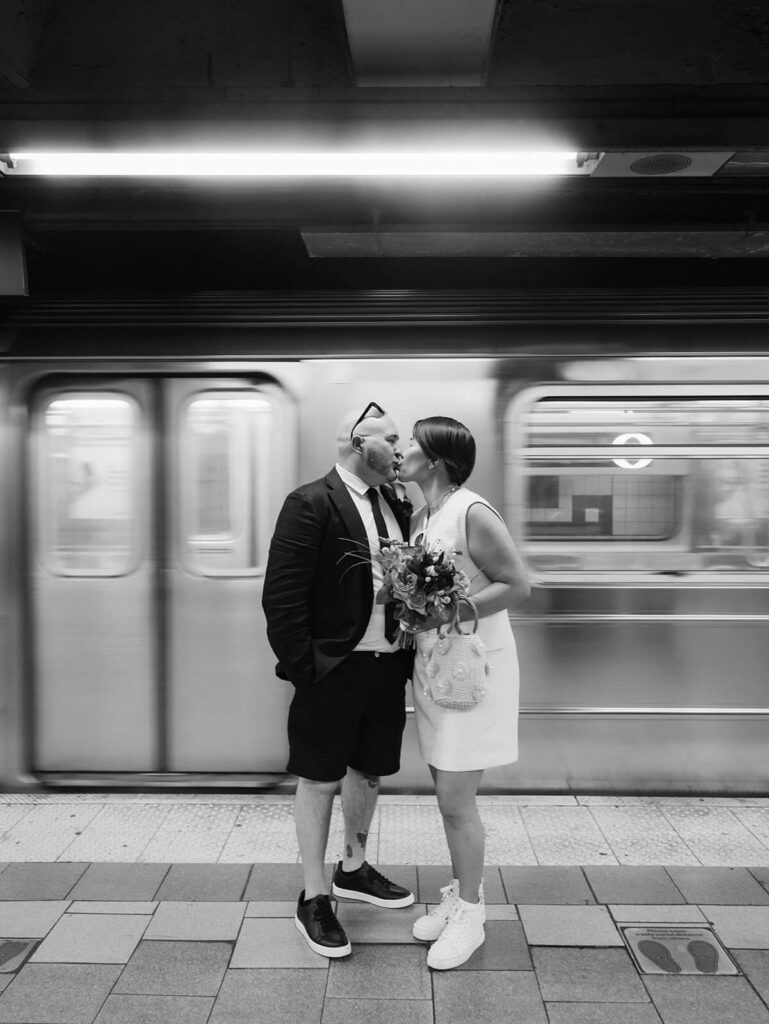 Newlyweds portraits after their courthouse ceremony at the NYC Courthouse subway station. Photo by OkCrowe Photography.
