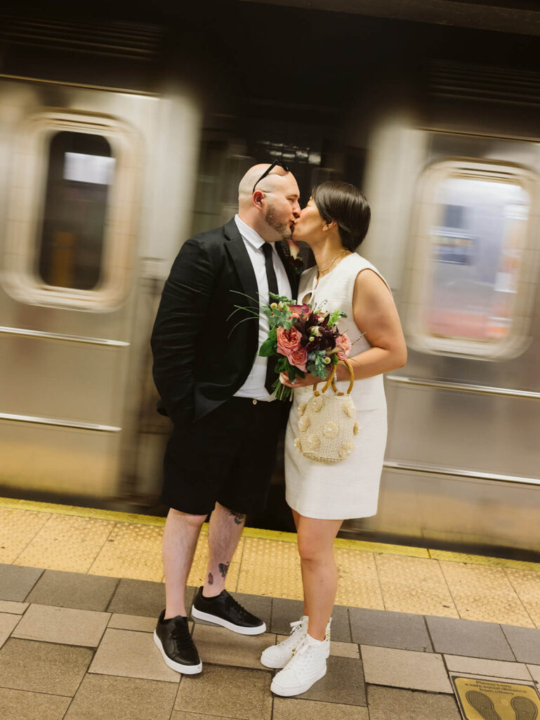 Newlyweds portraits after their courthouse ceremony at the NYC Courthouse subway station. Photo by OkCrowe Photography.