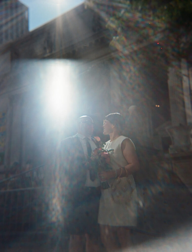 Newlyweds portraits at the New York Public Library after their courthouse ceremony at the NYC Courthouse. Photo by OkCrowe Photography.