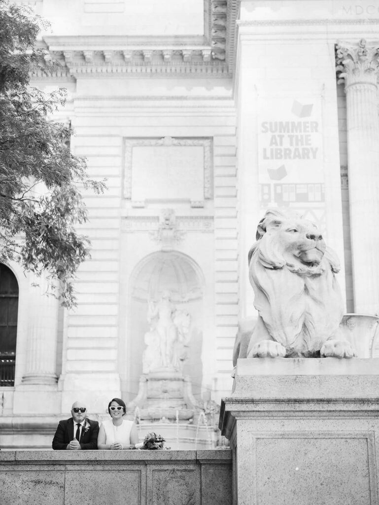 Newlyweds portraits at the New York Public LIbrary after their courthouse ceremony at the NYC Courthouse. Photo by OkCrowe Photography.