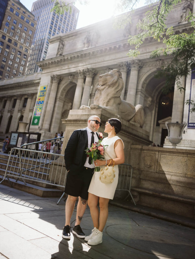 Newlyweds portraits at the New York Public Library after their courthouse ceremony at the NYC Courthouse. Photo by OkCrowe Photography.