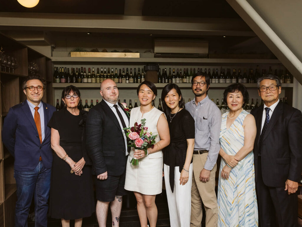 Family portraits during a small wedding reception after a courthouse elopement in the NYC courthouse. Photo by OkCrowe Photograpy. 