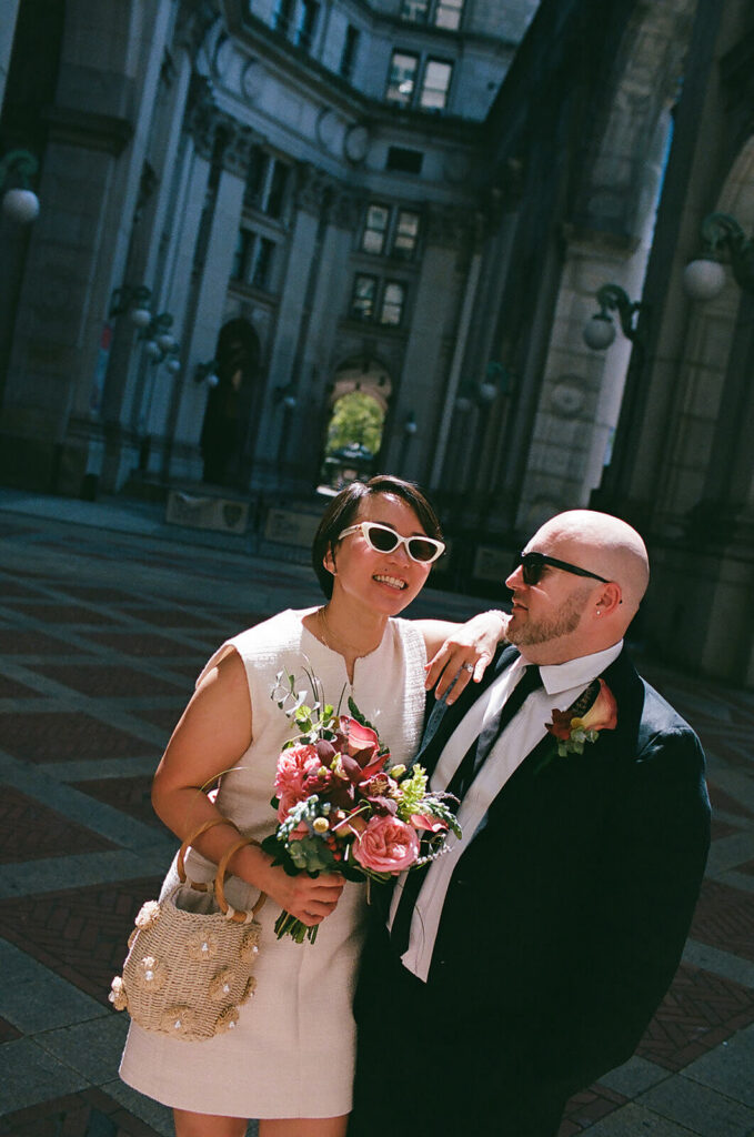 Newlyweds outside the NYC Courthouse. Photo by OkCrowe Photography.