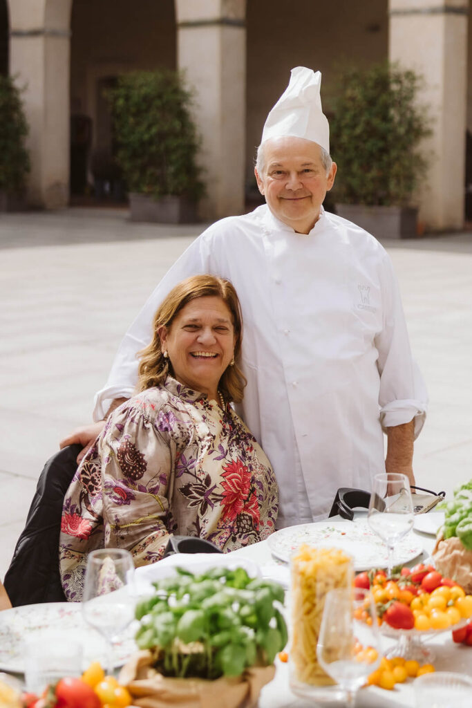Venue manager Francesca Bellini and her husband and head chef, Paolo Franchi at the Italian style lunch at the Castello Visconteo courtyard prepared by the Castelloa Visconteo team. Photo by OkCrowe Photography. 