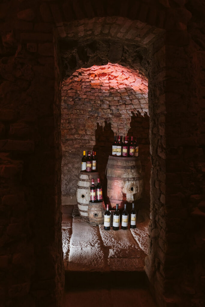 Wine tasting in the dungeon of Castello Visconteo. Photography by OkCrowe Photography.  