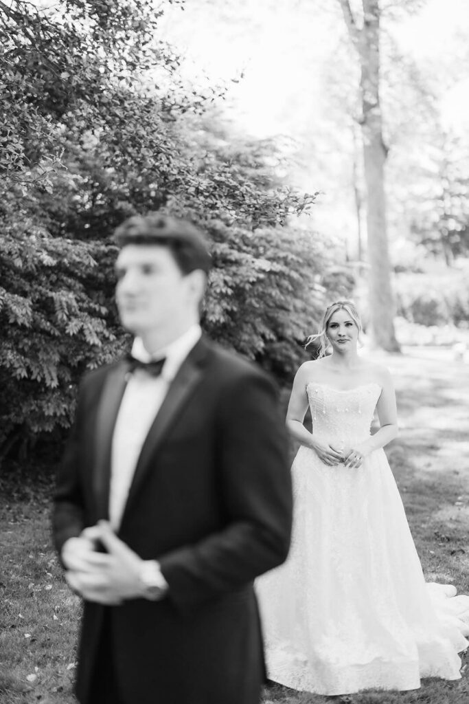 Bride anad groom first look in the gardens at the Mansion at Oyster Bay. Photo by OkCrowe Photography.