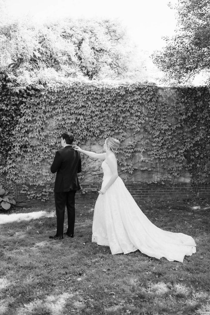 Bride anad groom first look in the gardens at the Mansion at Oyster Bay. Photo by OkCrowe Photography.