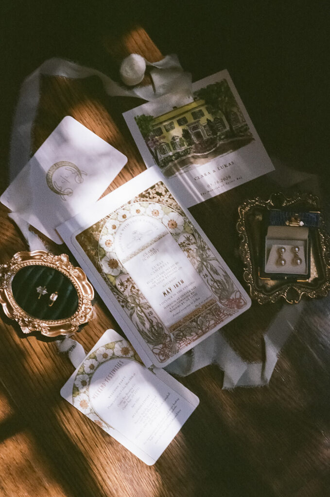 Flat lay of a wedding invitation suite at the Mansion at Oyster Bay. Photo by OkCrowe Photography. 