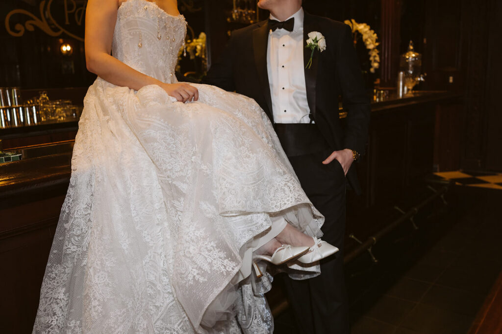 Bride and groom portraits at the Midnight Room, the hidden speakeasy at the Mansion at Oyster Bay. Photo by OkCrowe Photography.