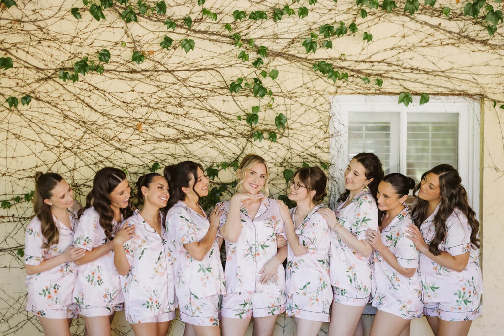 Bride getting ready with her bridesmaids in the bridal suite at the Mansion at Oyster Bay. Photo by OkCrowe Photography.