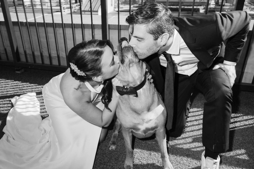 Bride and groom portraits on the balcony of the 33 Seaport Hotel. Photo by OkCrowe Photography.