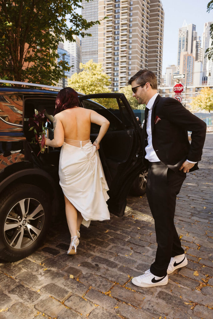 Bride and groom getting into a taxi outside the 33 Seaport Hotel. Photo by OkCrowe Photography.