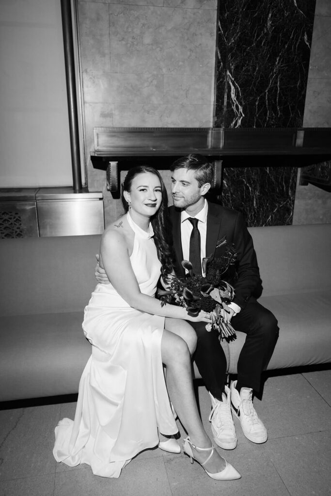 Bride and groom waiting inside the NYC courthouse for their elopement. Photo by OkCrowe Photography.
