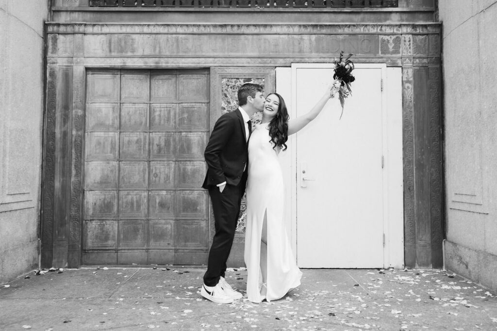 Newlywed photos after their elopement ceremony outside the NYC Courthouse. Photo by OkCrowe Photography.