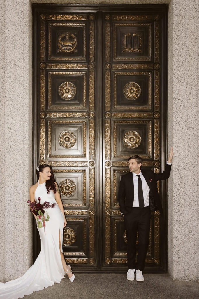 Newlywed photos after their elopement ceremony outside the NYC Courthouse. Photo by OkCrowe Photography.