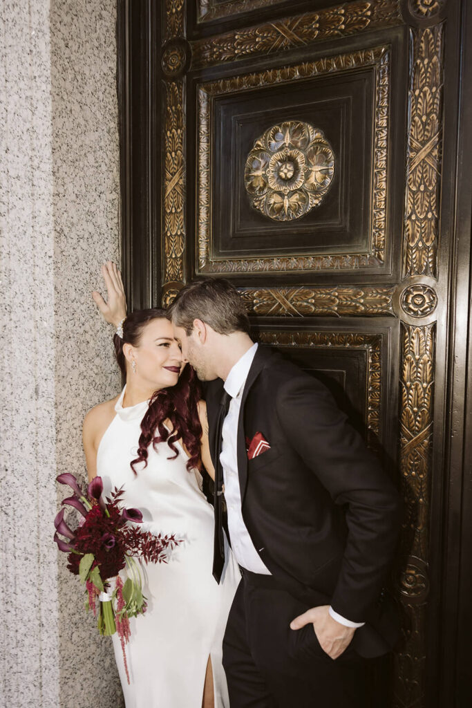 Newlywed photos after their elopement ceremony outside the NYC Courthouse. Photo by OkCrowe Photography.