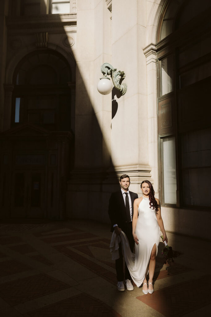 Newlywed photos after their elopement ceremony outside the NYC Courthouse. Photo by OkCrowe Photography.