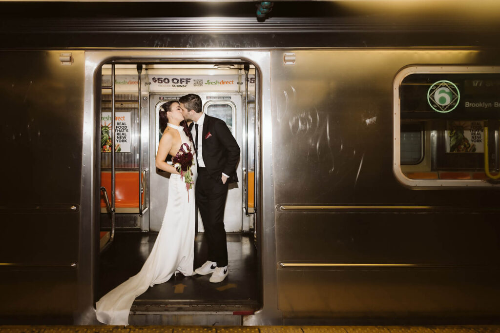 Newlywed photos inside the City Hall Subway Station. Photo by OkCrowe Photography.