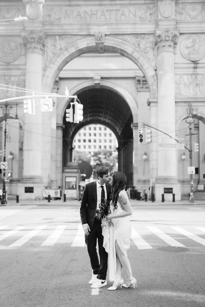 Newlywed photos walking through the streets of NYC. Photo by OkCrowe Photography.