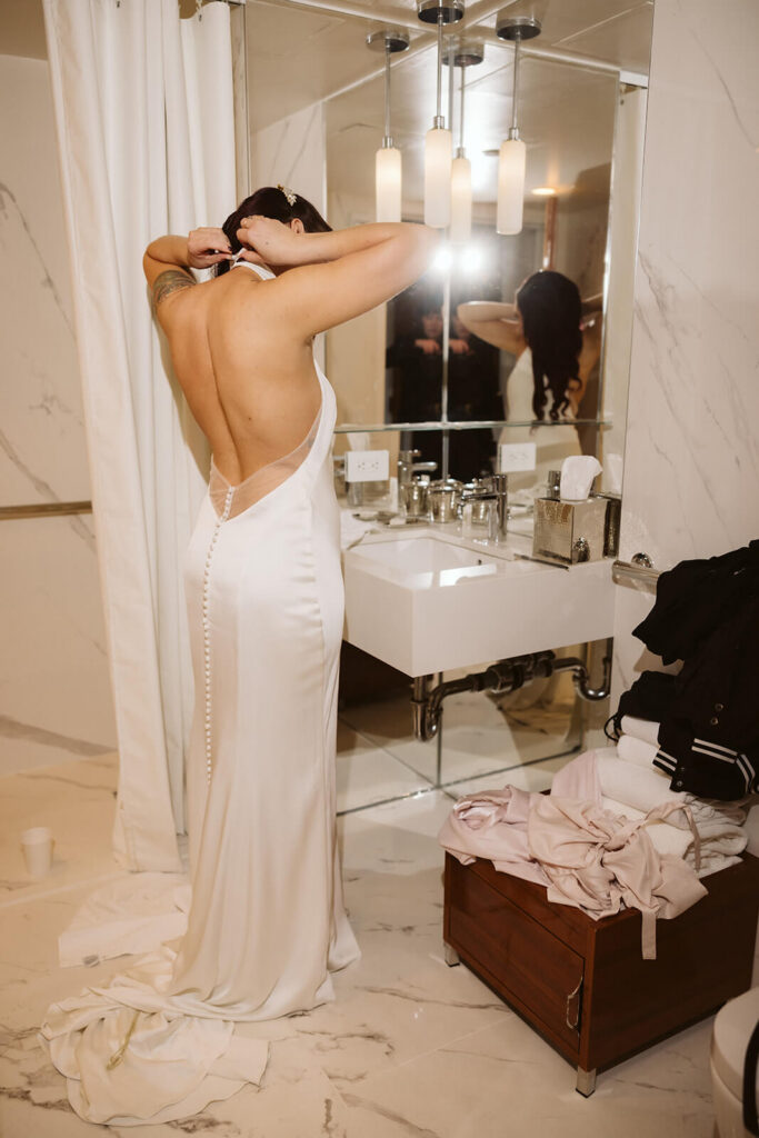 Bride getting ready at the 33 Seaport Hotel. Photo by OkCrowe Photography.
